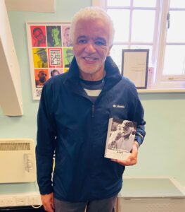 Wally Brown holding book